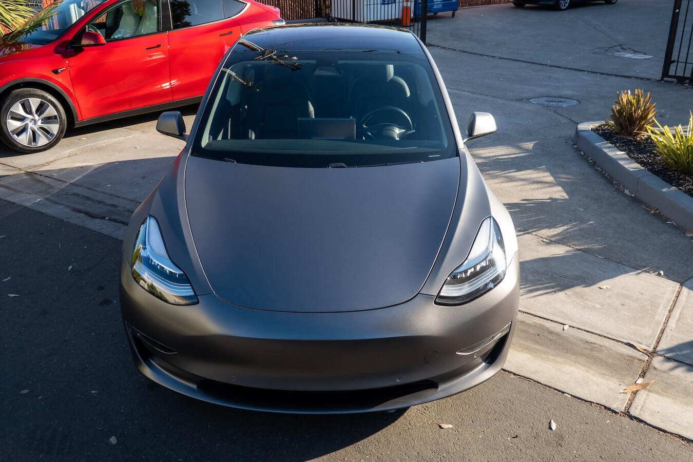 Tesla Model 3 wrapped in 3M 1080 Matte Deep Black vinyl